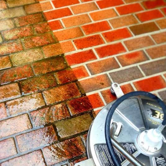 Pressure washing brick driveway